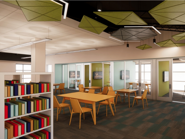 Interior of the library showing book shelve, seating, and study rooms.